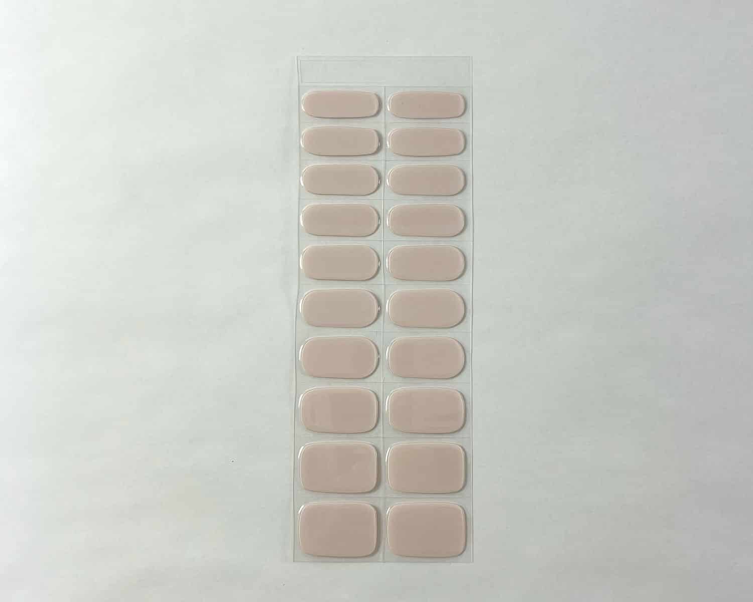 Baby pink semi-cured gel nails strip showing 20 pieces with 10 different sizes on white background