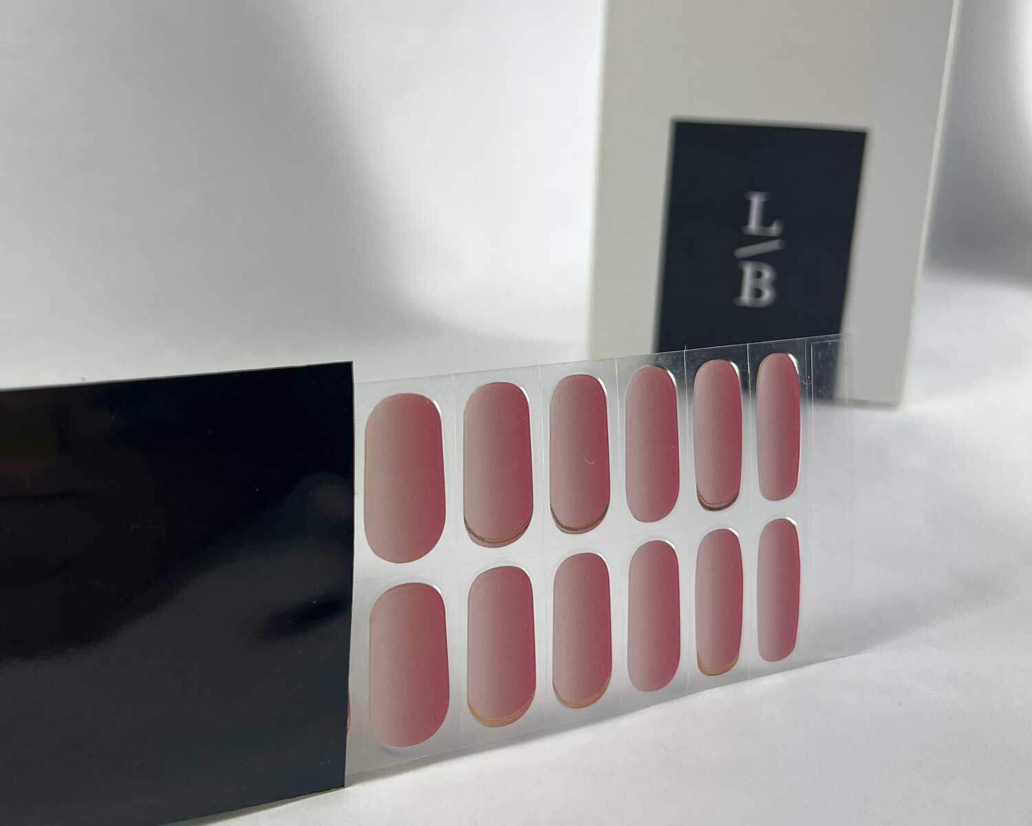 Golden sunset pink semi-cured gel nails strip showing 20 pieces with 10 different sizes on white background