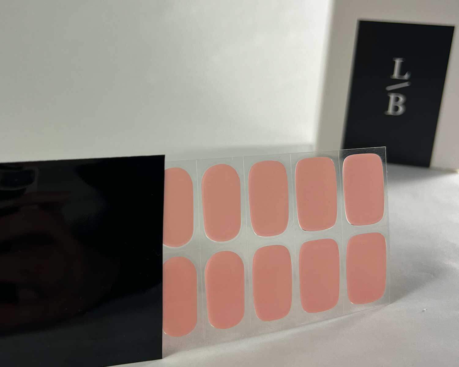 semi-cured-Gel-Nail-Sticker-strawberry-sunday-black-strip Strawberry Sunday pink semi-cured gel nails in black light sensitive strip with la-bek uv lamp box in the background