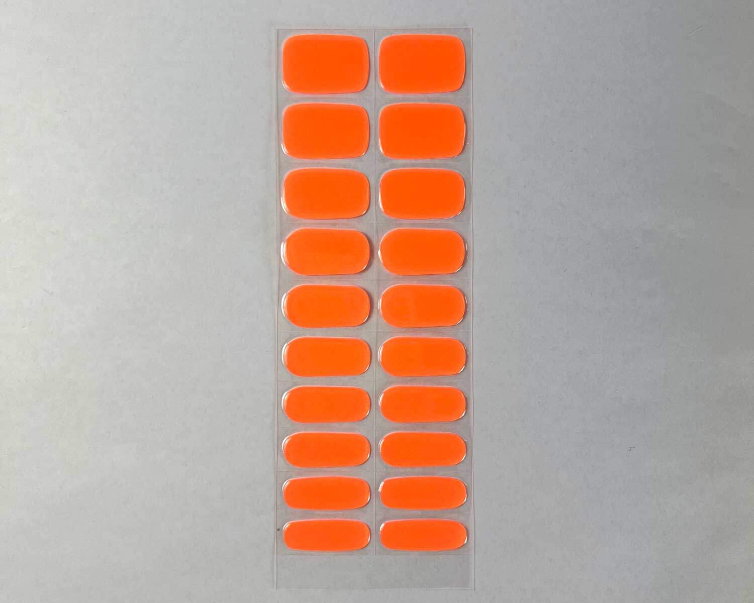 Neon Orange Glow in the dark Semi-cured gel nails feature an image showing 3 sizes snapshot on white background