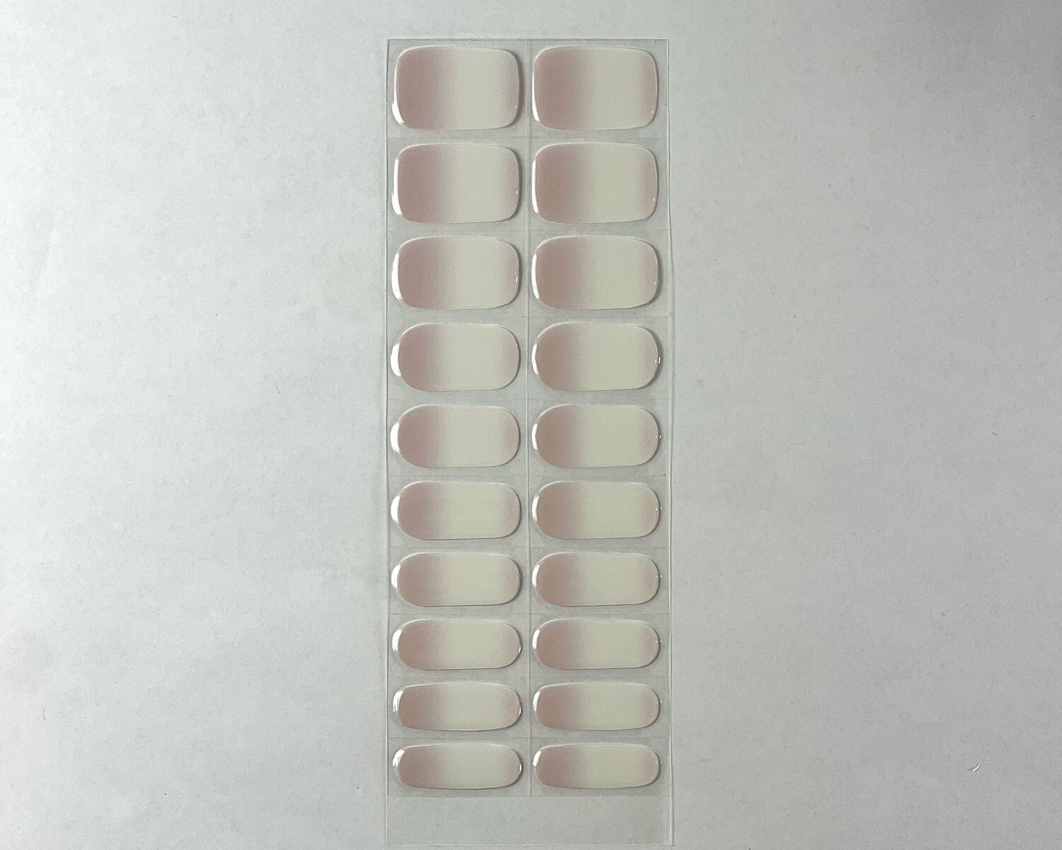 Pink Tide semi-cured gel nails strip showing 20 pieces with 10 different sizes on white background