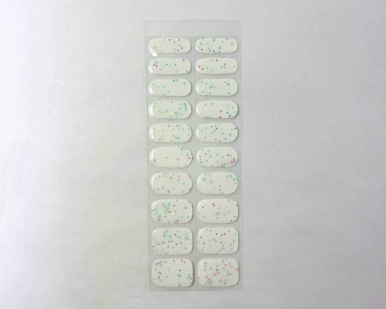 Sprinkle snow Glow in the dark white semi-cured gel nails strip showing 20 pieces with 10 different sizes on white background