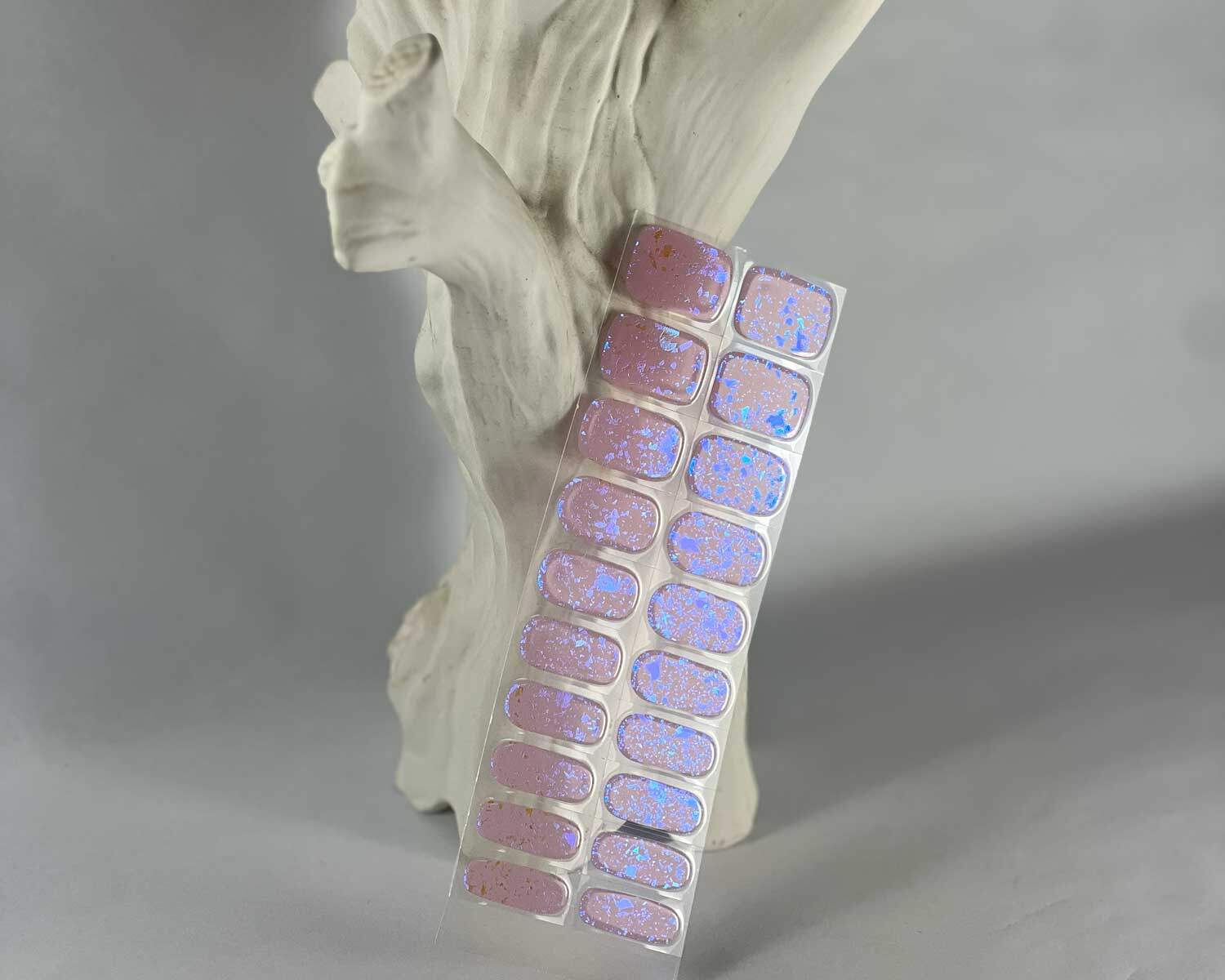 Pink Speckle Orange semi-cured gel nails in mockup to show product against white textured tree