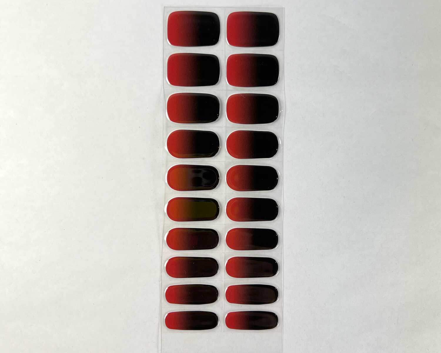 true-blood-semi-cured-gel-nail-strip True Blood red and black semi-cured gel nails strip showing 20 pieces with 10 different sizes on white background
