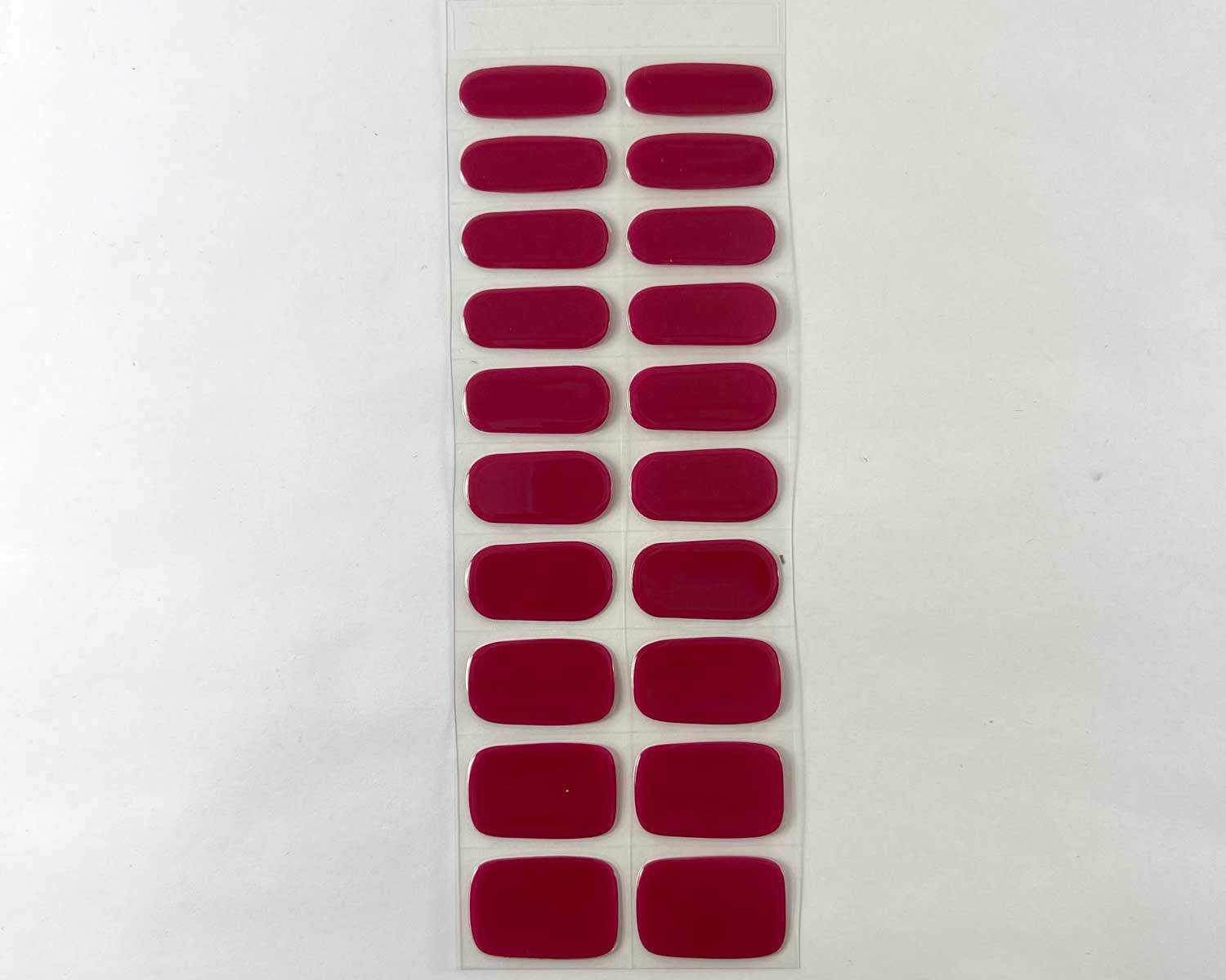 magenta moment semi cured gel nails strip showing 20 pieces with 10 different sizes on white background