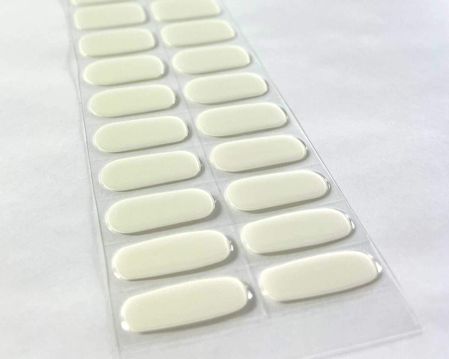 storm white grey semi-cured gel nails on angle zoomed in on white background