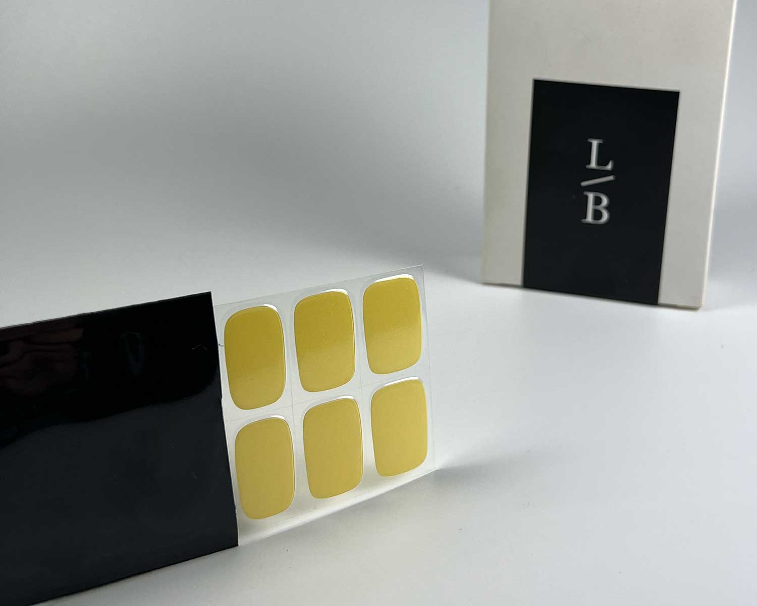 lemon-sherbet-semi-cured-gel-nails-black-strip