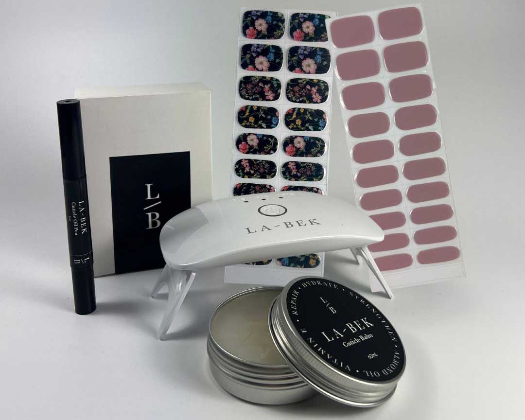 Plum-Bouquet-Grow-out-starter-kit Grow Out Starter Kit with cuticle oil, balm and semi-cured nail wraps displayed
