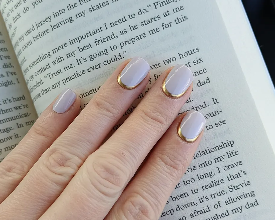 Semi-cured gel nail wraps in teal chrome on customers hand